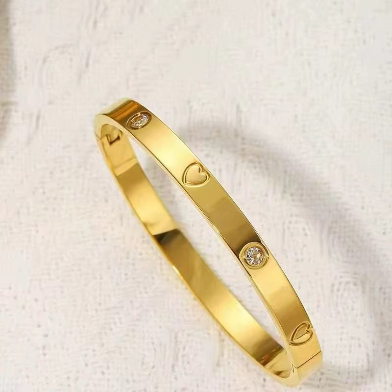 41062 - pulsera acero corazones con cristales dorado