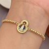 41086-1 Pulsera balines virgen con perlas