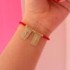 41168-1 Pulsera roja balines escapulario cruz / virgen