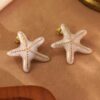 80110-1 Zarcillos acero esmaltado estrella blanco