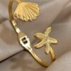 41186 - Pulsera acero dorada almeja y estrella
