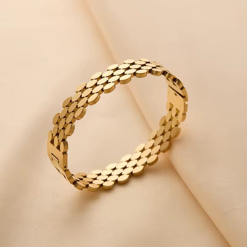41038 - Pulsera Acero dorada multi forma