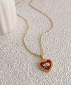 20225 - Collar armado corazon con ojo rojo