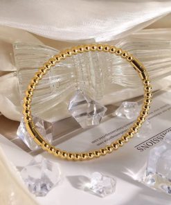 41011 - pulsera acero multi bolitas dorada