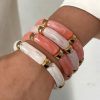 41039 - Set 4 pulseras acrilicas blanco-Rosa