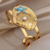 41077 - Pulsera Acero dorada Caparazon