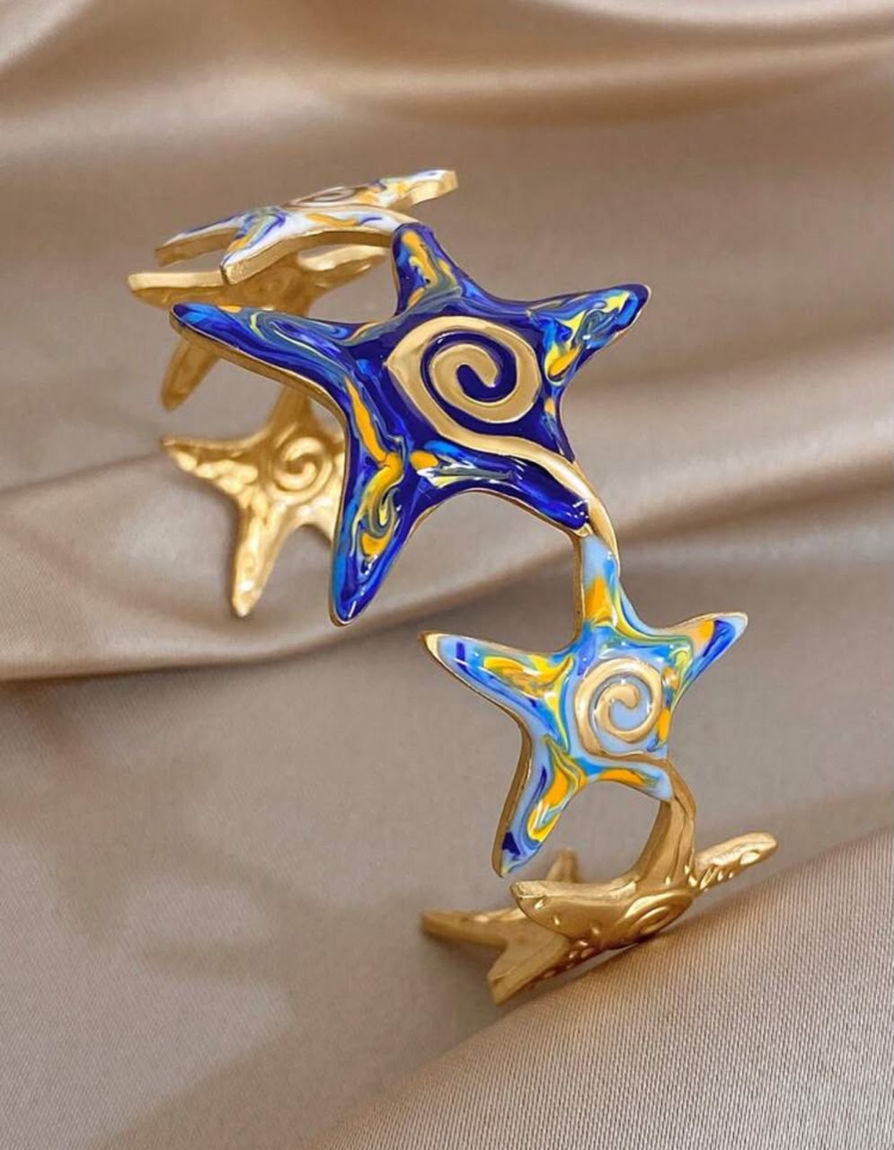41078 - Pulsera Acero dorada multi estrella color