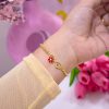 20124 - Pulsera armado infinito con flor y corazon