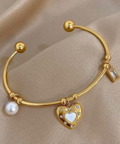 41105 - Pulsera Acero dorada multi dije