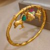 41106 - Pulsera Acero dorada multi dije