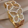 41149 - Pulsera acero dorada multi mariposa con cristales