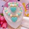 21169 - Set collar chicle turquesa con beige