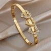 41202 - Pulsera acero dorado tri corazon