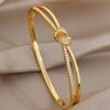 41208 - Pulsera acero dorado nudo con cristales