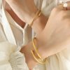 41209 - Pulsera acero dorado guaya