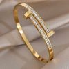 41216 - Pulsera acero dorado bi clavo