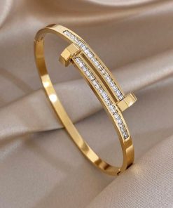 41216 - Pulsera acero dorado bi clavo