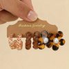 80486-1 Set 3 Par zarcillos flor naranja con perla blanco