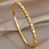 41263 - pulsera acero dorado multi trebol con cristales